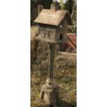 A reconstituted stone birdhouse. 174cm high. This lot must be collected from S44 5SU on Friday 23/