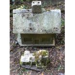 A reconstituted stone birdhouse and a stone house garden ornament . (2). This lot must be