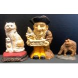 A cast iron door stop as a street vendor musician with animal clown; others smaller cats (3)