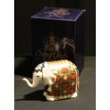 A Royal Crown Derby paperweight, Elephant, 1128 pattern trunk raised, gold stopper, first quality,