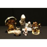 A Lladro figure, Puppy Meets Kitten, 5032 B-22M, 18cm, printed and impressed marks; a Goebel