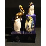 A Royal Crown Derby paperweight, Penguin and Chick, gold stopper, boxed; others, Rockhopper Penguin,