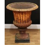 A large Victorian cast iron fluted campana shaped garden urn, square base, 76cm high, 64cm diameter,