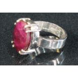 A 925 sterling silver ring set with a faceted red stone
