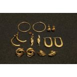 A pair of 9ct gold hoop earrings, marked 9ct; a pair of 9ct gold Creole earrings, marked 375; two