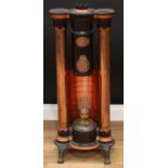 A Clark's patent Syphon hygenic stove, cast iron with copper mounts, 89cm high, 36cm wide, 19cm deep
