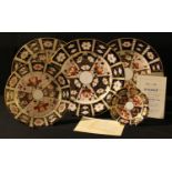 A Royal Crown Derby Imari 2451 pattern dinner plate; two others; a 2451 pattern side plate; an