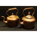 A Victorian copper kettle, acorn knop finial, 30cm high; another smaller, 28.5cm high (2)