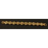 A 9ct gold fancy link bracelet, 18cm unclasped, marked 375, 16.57g, boxed