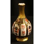 A Royal Crown Derby Imari palette 1128 pattern lobed bottle vase, 16cm , printed mark in red