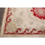 A large Chinese wool carpet, worked in the traditional manner, 458cm x 332cm