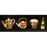 A Royal Crown Derby Imari palette 1128 pattern miniature teapot, 8.5cm, printed mark; an Old Imari