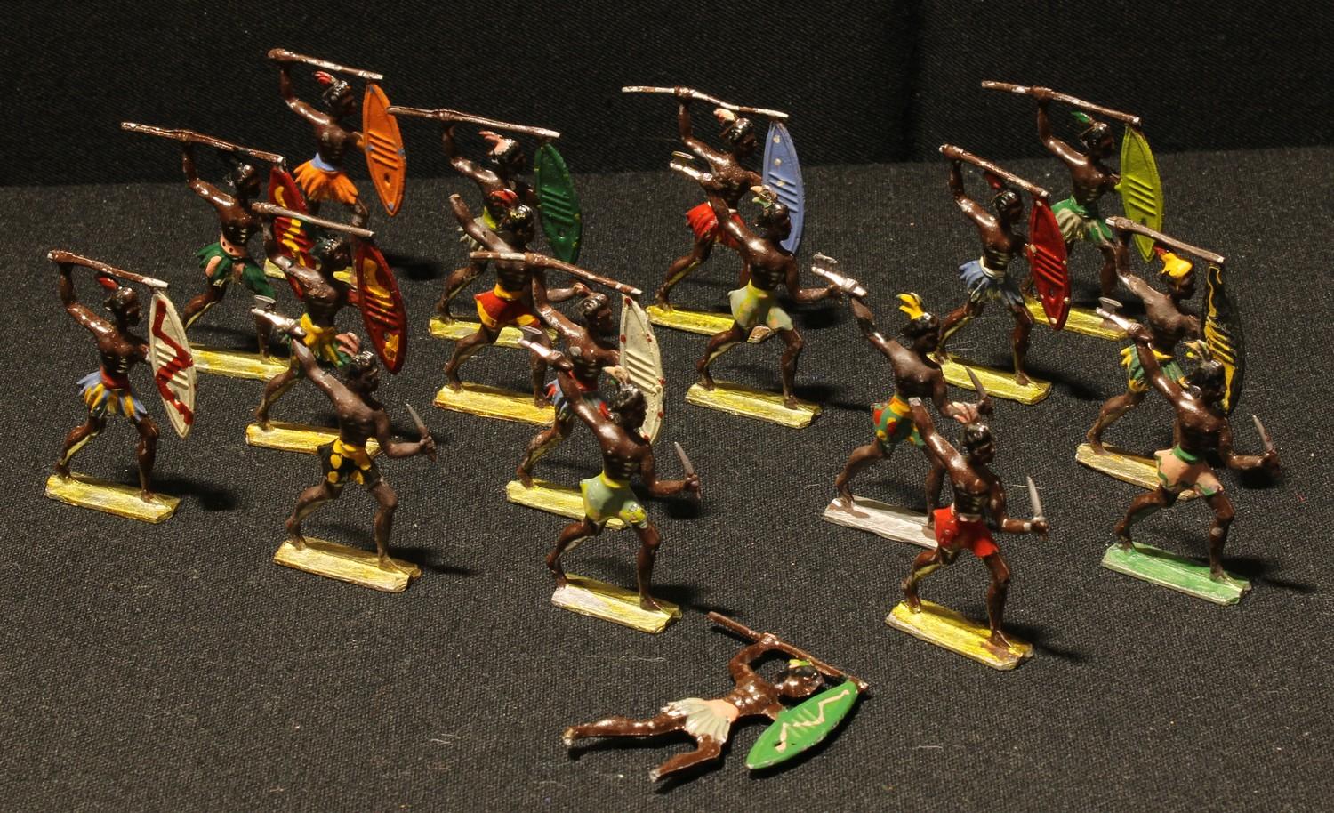 Toys - a collection of painted lead semi flat Zulu tribal warrior figures, various poses,