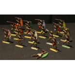 Toys - a collection of painted lead semi flat Zulu tribal warrior figures, various poses,