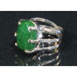 A 925 sterling silver ring, set with a polished green stone cabochon