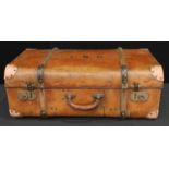 An early 20th century suitcase, cabin bound with riveted joints, brass fittings, 71cm long