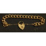 A 9ct gold curb link bracelet, 9ct gold love heart clasp, safety chain, 31.1g