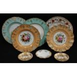 A pair of Royal Crown Derby shaped circular cabinet plates, painted with a spray of summer flowers