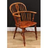 A 19th century elm country house Windsor elbow chair, hoop back, shaped and pierced splat, bowed