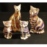 A Royal Crown Derby paperweight, Siamese Cat, gold stopper; others, Cat and two kittens, all gold