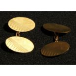 A pair of 9ct gold oval engine turned cuff links, marked 375, 5g