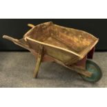 A 20th century wooden wheelbarrow.