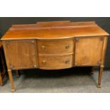 A 20th century mahogany bow front sideboard, shaped half gallery, shaped rectangular top above two