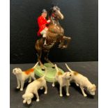 A Beswick model Rearing Huntsman, model 868, four assorted hounds (5)