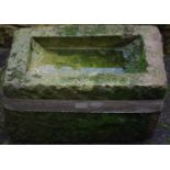 Derbyshire gritstone millstone stand. 29cm high x 53cm long x 33cm wide.