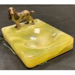 A painted metal figure of a spaniel dog standing, mounted on a green onyx base, 74mm high, 14cm