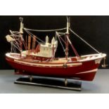 A wooden model of a trawler.40cm high x 60cm long x 17cm wide.