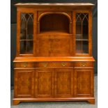 A late 20th century burr walnut cocktail/display cabinet, stepped cornice, recess over fall front