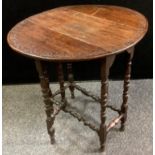 A Victorian oak Sutherland table, oval top, carved border, turned legs. 68cm high x 61cm wide x 27.