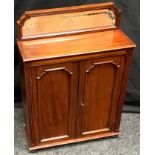 A Victorian mahogany mirror back cabinet of small proportions, shaped bevel edge mirror back to top,