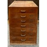 A seven drawer mahogany filing cabinet. 73.5cm high x 49cm wide x 56cm deep.