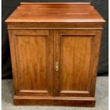 A late Victorian mahogany cabinet, shaped gallery, moulded top, two panel doors, plinth base. 98cm