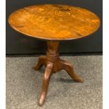 A George III' oak tripod occasional table, circular top, turned column, cabriole legs, 55cm high,