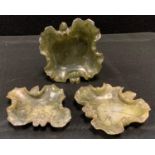 Geology - a carved Chinese green mottled stone scribes bowl as a qua-trefoil leaf dish, 12.5cm x