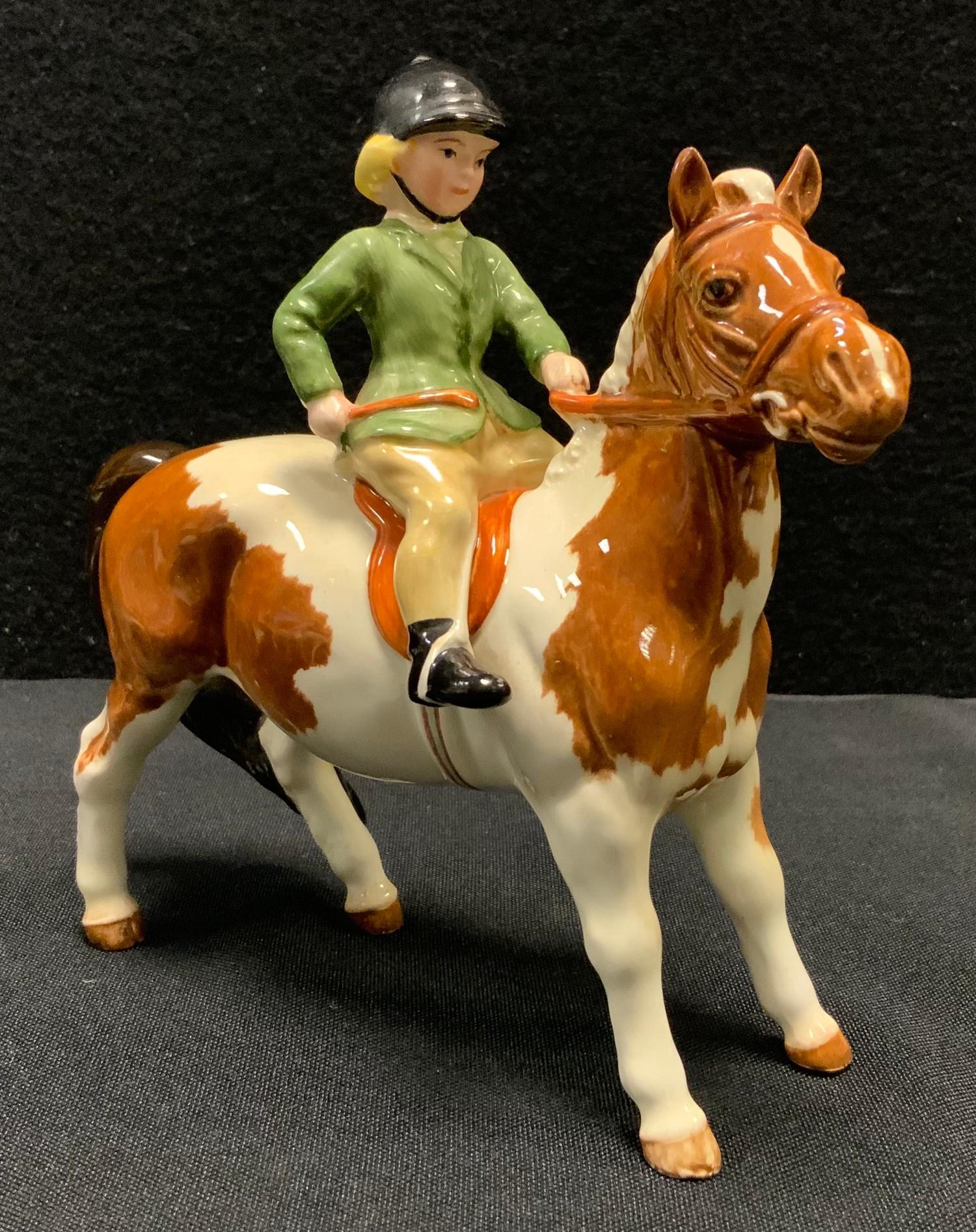 A Beswick model Girl on Pony, 1499, Skewbald, printed marks