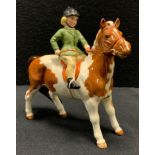 A Beswick model Girl on Pony, 1499, Skewbald, printed marks