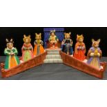 A Royal Doulton Bunnykins Tudor Collection Henry VIII and his wives set on display stand, inc Anne