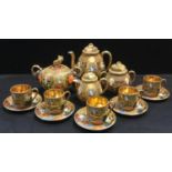 A Japanese Satsuma exportware coffee set decorated with traditional deities and figure, etc qty