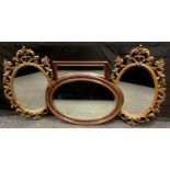 An Edwardian oval wall mirror, a modern rectangular wall mirror, a pair of modern gilt framed oval