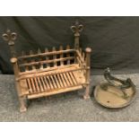 A cast iron country house fire basket, 47cm high; a Victorian cast iron boot scraper. (2)