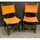 A pair of 20th century chairs, leather strap backs and seats.(2)