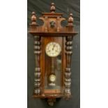 A 19th century mahogany Vienna wall clock, 14.5cm circular dial with Roman numerals, 103cm overall