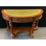 A Victorian style demi lune side table desk, leather inset top, single frieze drawer, turned and