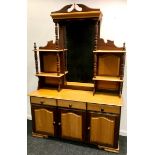 A South African imbula and yellow wood dresser, shaped mirror and shelving to top, three short