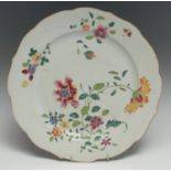 An 18th Chinese famille rose shaped circular charger, typically painted with peonies and