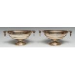 A pair of Neo-Classical silver plated oval pedestal sauce tureens, acanthus-capped loose-ring